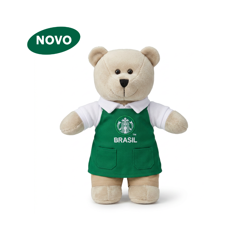 Urso Bearista em pelúcia com avental verde.