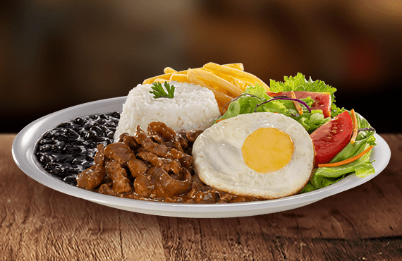 Iscas bovinas suculentas (aprox. 120g in natura) preparadas com nosso exclusivo molho acebolado e finalizadas com um ovo frito. Acompanha: Arroz soltinho, feijão, salada fresca, fritas e molho.