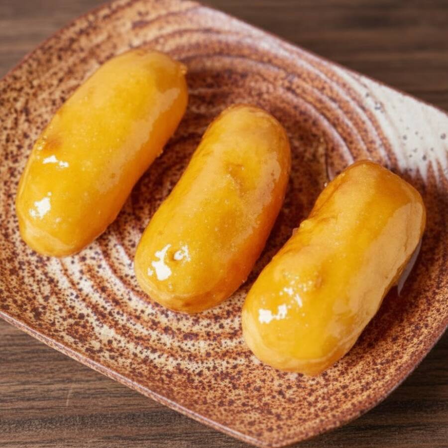 A clássica sobremesa chinesa, banana envolvida em massa leve caramelada.