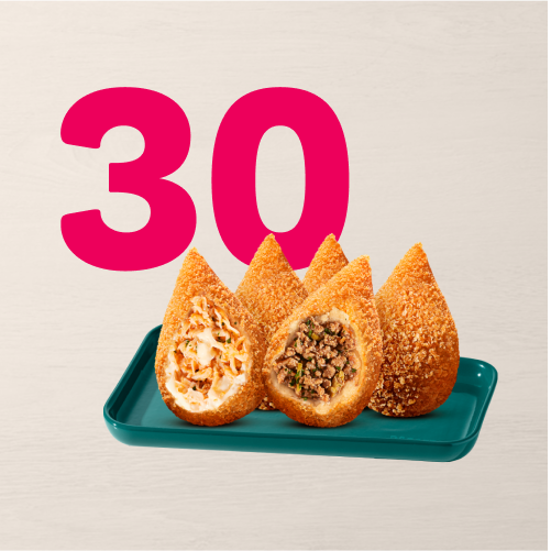 Escolha 30 unidades das nossas deliciosas Coxinhas Clássicas, entre os sabores: Frango com Cremely, Calabresa ou Carne. Irresistível. Cuidado, recheio quente.