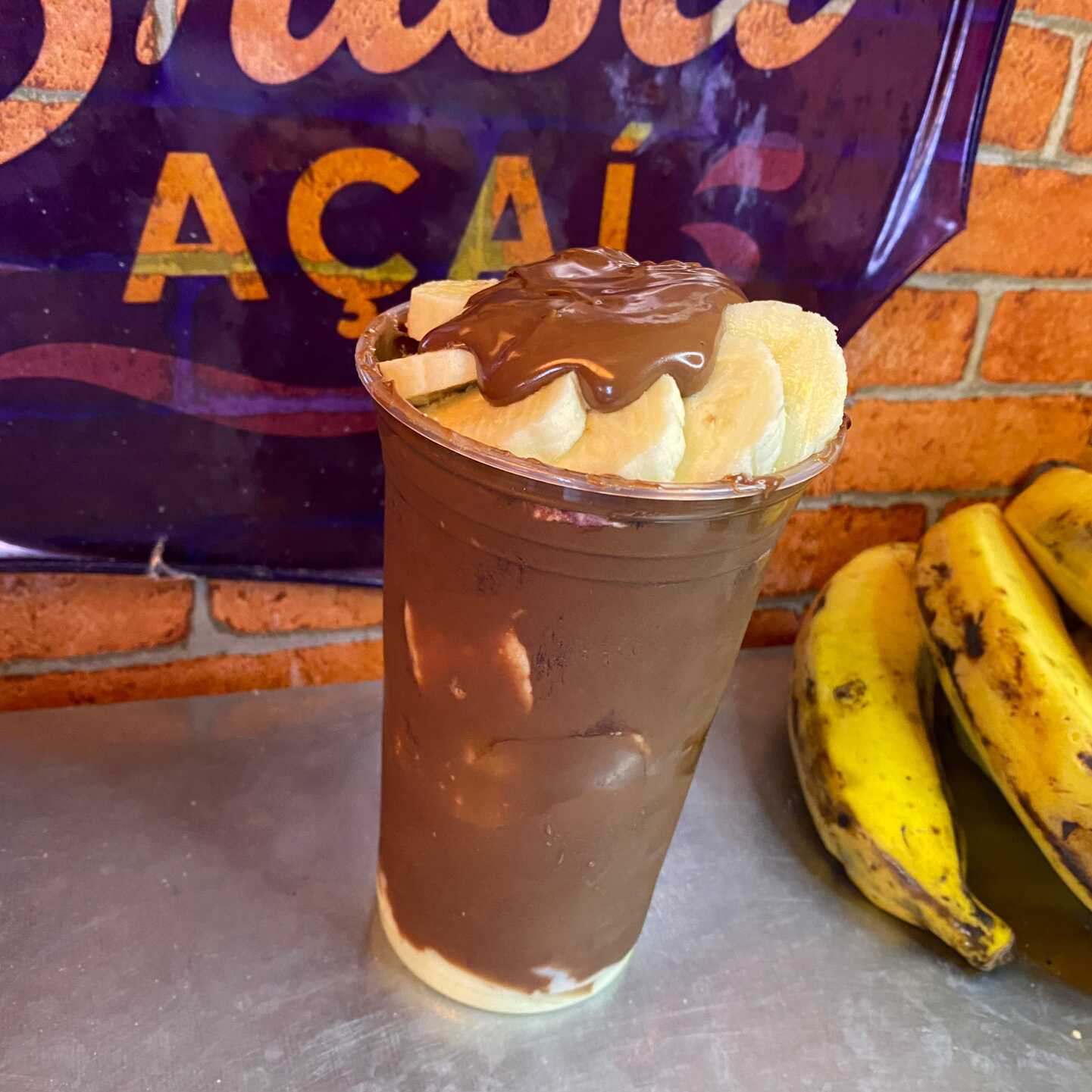 Açaí, leite em po, paçoca, banana, nutella e leite condensado