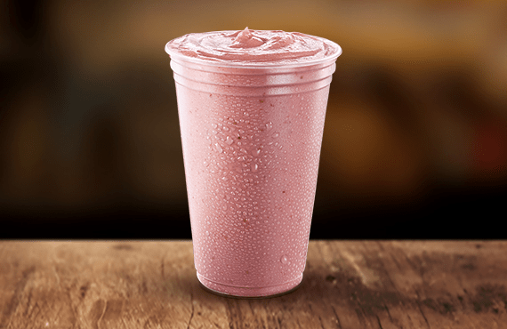 Cremosidade máxima em cada gole! Nosso clássico Milk-shake de Morango 400ml, batido na hora com sorvete de alta qualidade para garantir aquela textura irresistível.