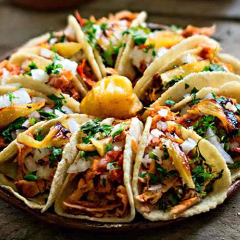 PAQUETE AMIGOS - 20 Tacos de Pastor + 3 Cocas