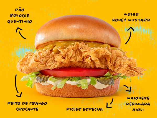 O queridinho da galera! Peito de frango empanado e crocante, com cerca de 115g, servido com alface, tomate, picles, maionese defumada e molho Honey Mustard, no pão tipo brioche.