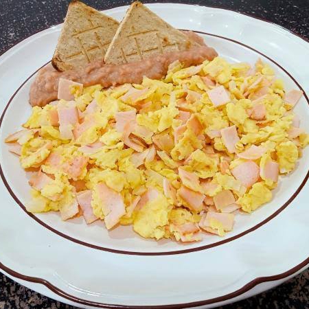 Huevos al gusto (salchicha, jamón, chorizo, etc.)