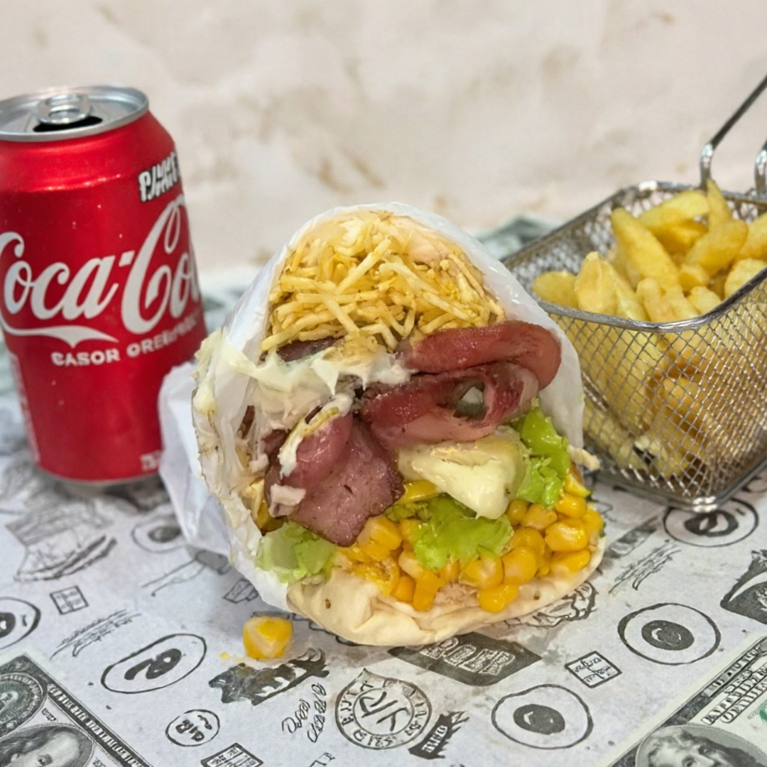 Acompanha um x calabresa bacon simples + uma porçao de batata 100g + uma coca lata