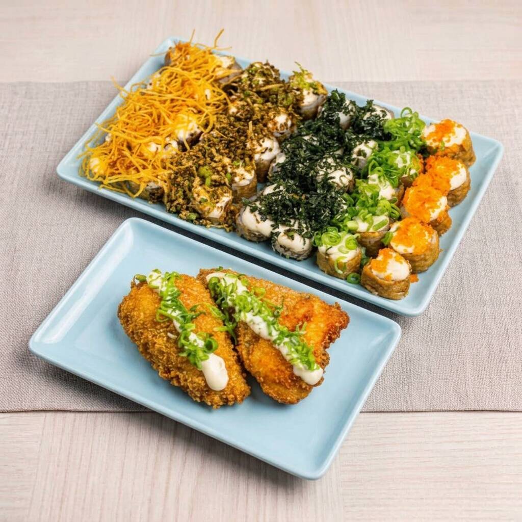 10 hot rolls com Doritos, 10 hot rolls com couve crispy, 10 hot rolls com batata crispy, 10 hot rolls tradicionais de cream cheese e 2 temakis empanados. Acompanha 2 hashis, 2 saches de molho shoyo e 2 saches de tarê.